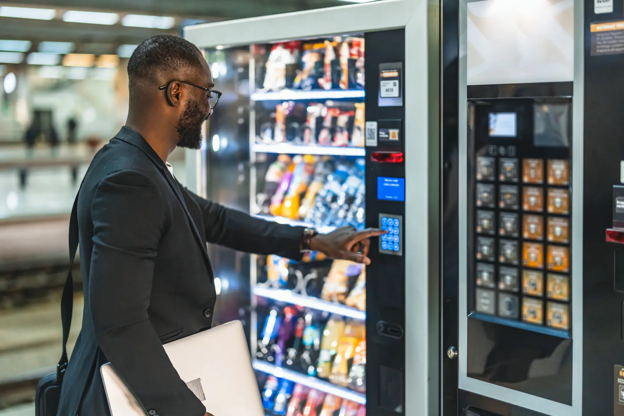 Man using a vending machine
