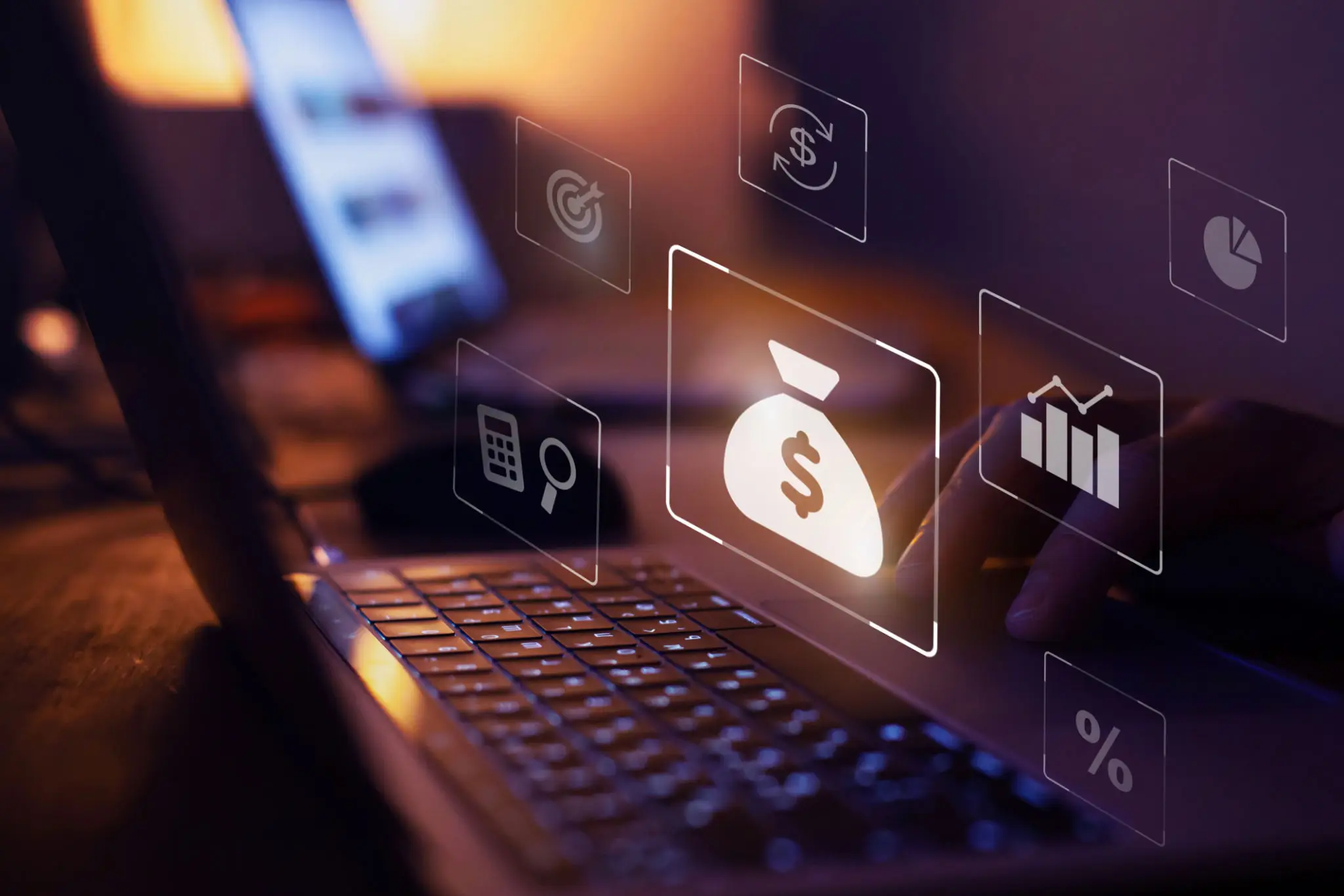 Laptop with floating finance icons and money bag